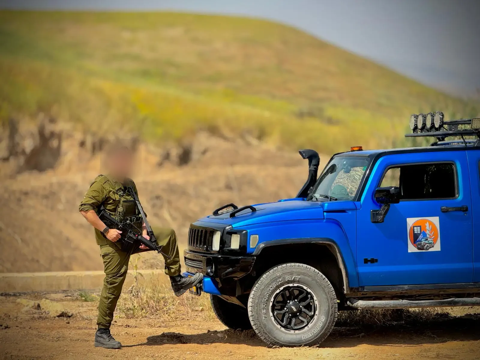 Har Tzion 0710 reservist beside the unit jeep